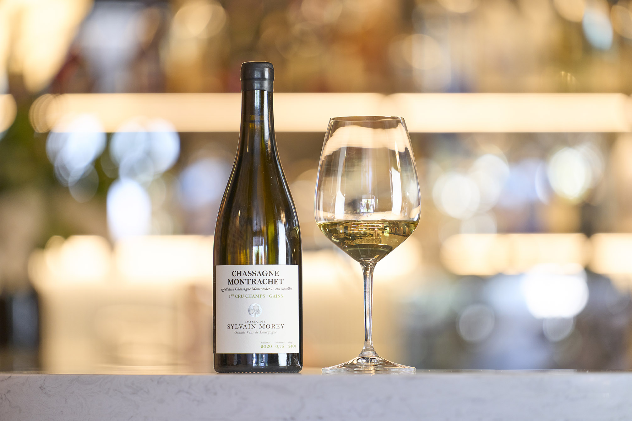 Chassange Montrachet wine and wine glass Image